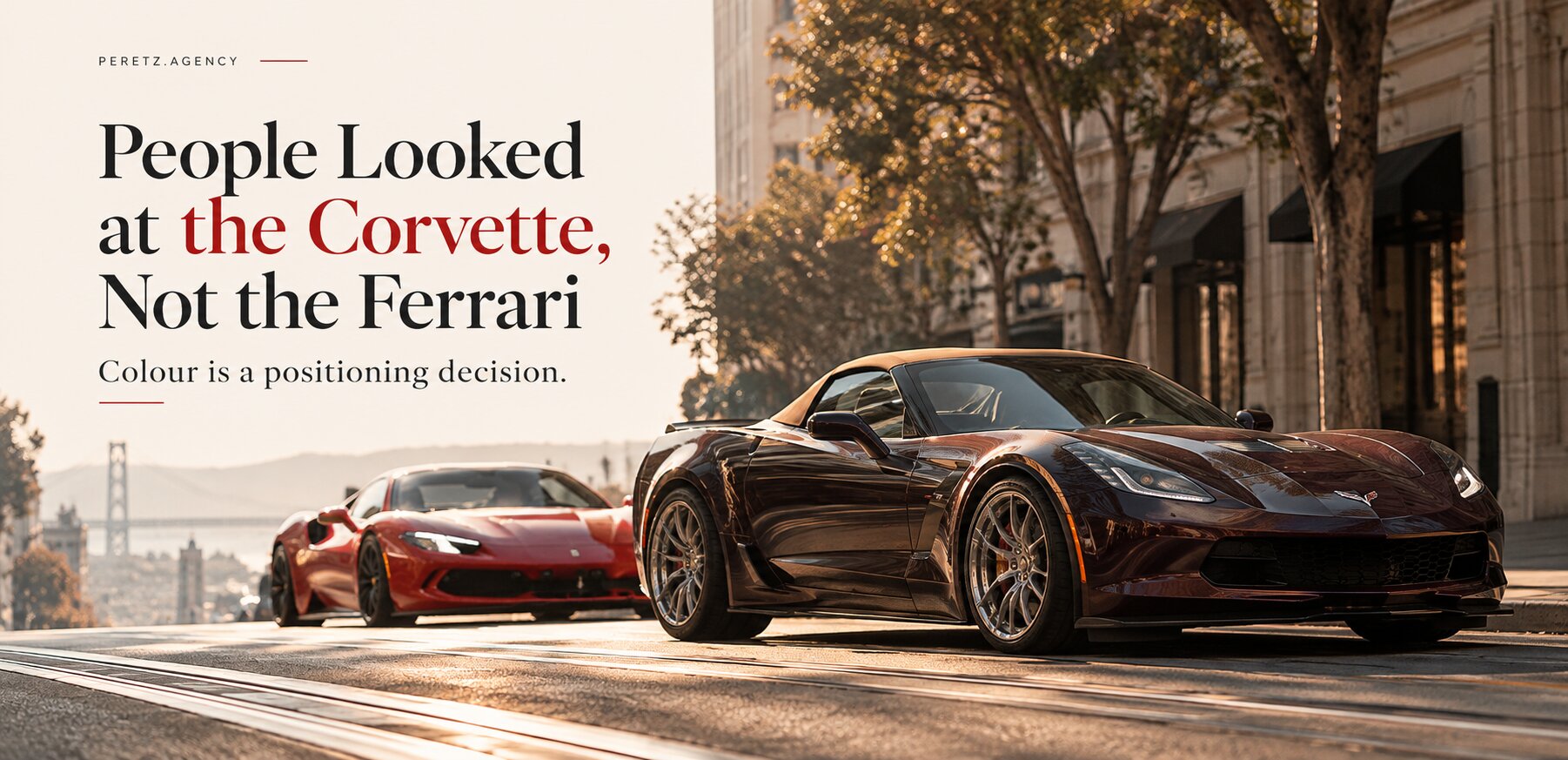 A dark Black Rose Corvette convertible with a camel top on Market Street in San Francisco