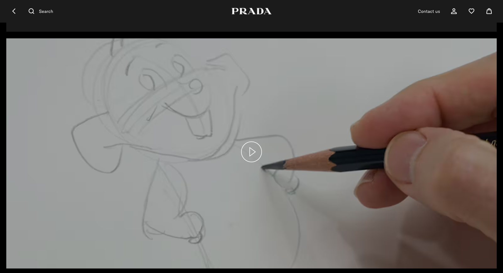 Frame from the Prada Holiday 2026 film: an animator draws a cartoon character in pencil on paper